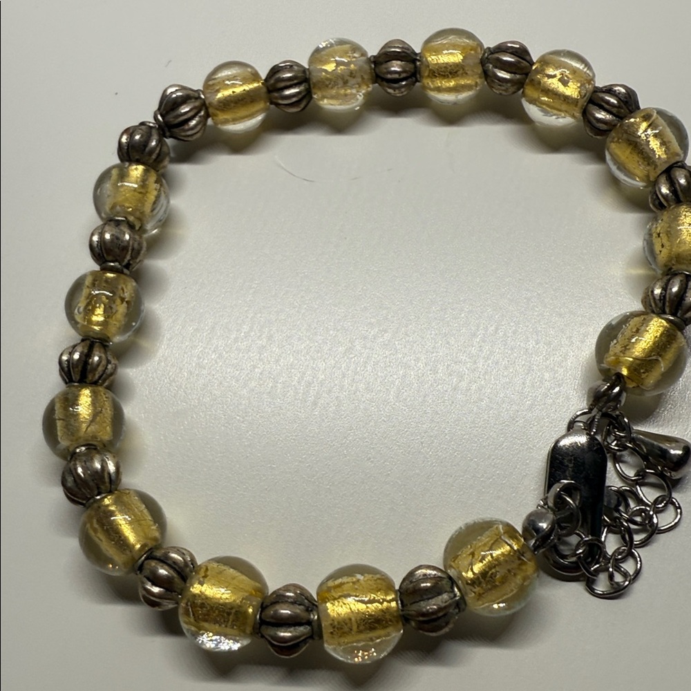Untested Elegant Gold swirl glass and Silver tone Beaded Bracelet larger size